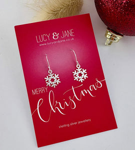 dangly sterling silver Snowflake earrings on a red 'Lucy & Jane' card with Christmas text