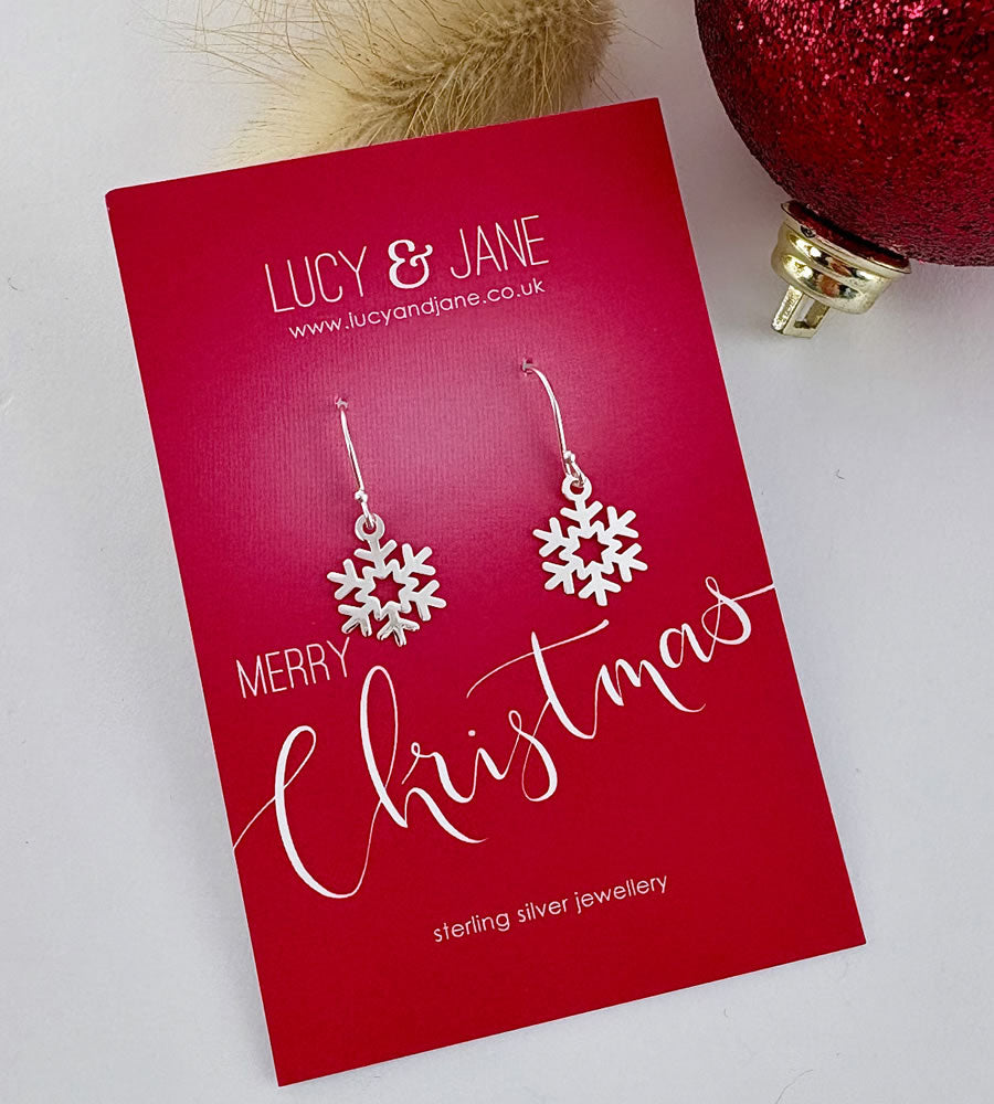 dangly sterling silver Snowflake earrings on a red 'Lucy & Jane' card with Christmas text