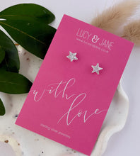 Load image into Gallery viewer, Sterling silver sparkly star earrings on a With Love card