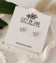 Load image into Gallery viewer, sterling silver sparkly star studs on a Lucy and Jane card