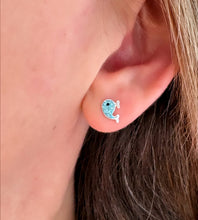 Load image into Gallery viewer, sterling silver sparkly blue whale studs in model's ear