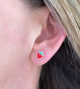 sterling silver red strawberry studs in model's ear