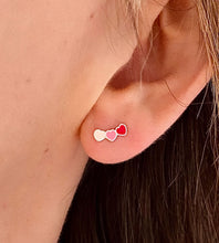 Load image into Gallery viewer, sterling silver hearts climber earrings in pink on model