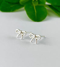 Load image into Gallery viewer, sterling silver tiny bow studs - earrings for kids or creating ear stacks