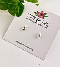 Load image into Gallery viewer, sterling silver teardrop earrings on a Lucy &amp; Jane branded card with green leaves in the background.
