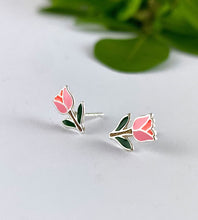 Load image into Gallery viewer, Sterling silver pink and green tulip earrings on a white background with green leaves in the corner.