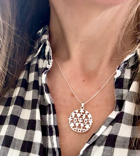 sterling silver woodland trees necklace on a model 