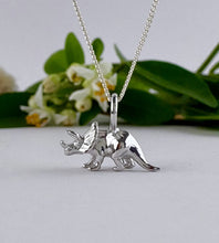 Load image into Gallery viewer, sterling silver triceratops dinosaur necklace.  Necklace for adults that love dinosaurs.  Small but very detailed 3D dinosaur necklace in the shape of a Triceratops