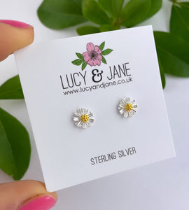 small sterling silver flower earrings with a tiny gold centre.