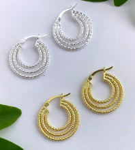Load image into Gallery viewer, textured triple hoops in sterling silver and matching pair of triple hoops in gold