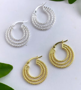 textured triple hoops in sterling silver and matching pair of triple hoops in gold