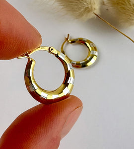 close up of sterling silver and gold two tone hoop