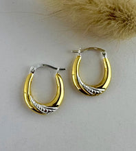 Load image into Gallery viewer, sterling silver and gold two tone hoop earrings. With a simple easy to wear lever fixing. Features some pretty texture detailing on the hoops.