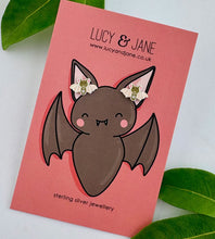 Load image into Gallery viewer, sterling silver brown bat stud earrings on a Halloween themed Lucy and Jane backing card
