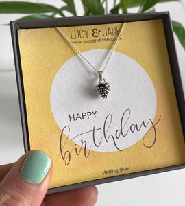 sterling silver pine cone necklace in a gift box with Happy Birthday card