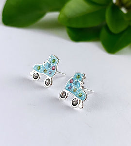 sterling silver roller skate studs in blue with a some colourful crystals to make them sparkle