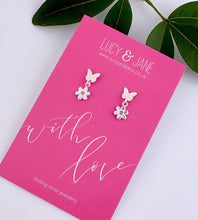 Load image into Gallery viewer, sterling silver butterfly and flower drop earrings on a 'with love' Lucy and Jane earring card