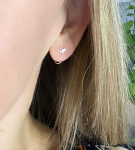 sterling silver butterlfly hoop earrings in model's ear