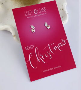 tiny sterling silver reindeer studs that are great for children.  Photographed on a 'merry christmas' backing card