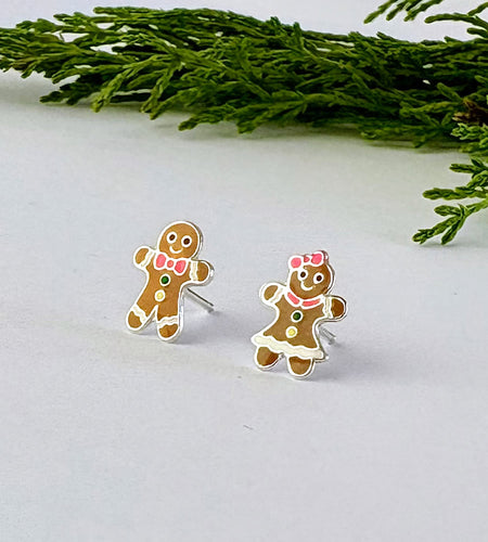Mismatched Christmas Sterling silver gingerbread earrings - featuring one gingerbread man earring and one gingerbread woman stud.