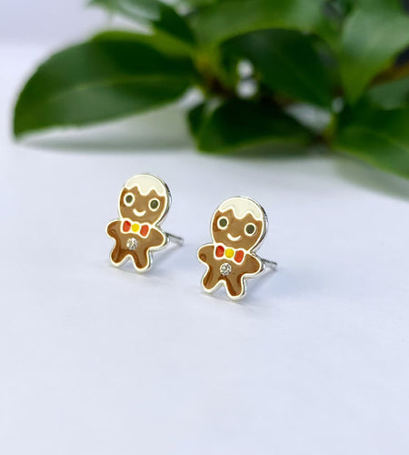 sterling silver gingerbread men earrings.  Brown with colourful red and yellow bow tie and a touch of white frosting on their heads