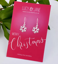 Load image into Gallery viewer, sterling silver snowflake dangly earrings on a Merry Christmas backing card