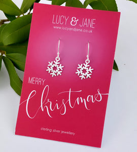 sterling silver snowflake dangly earrings on a Merry Christmas backing card