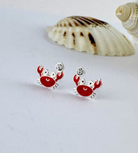 Load image into Gallery viewer, sterling silver crab ear studs holding a tiny clear crystal. Small earrings that are great for children