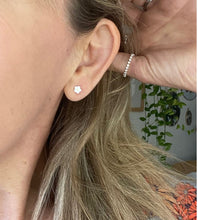 Load image into Gallery viewer, sterling silver white daisy stud in models ear