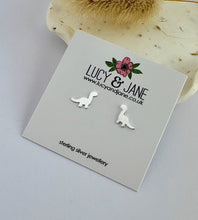 Load image into Gallery viewer, Sterling Silver dinosaur earrings on a Lucy &amp; Jane branded card.
