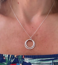 Load image into Gallery viewer, sterling silver handmade double circle necklace with one larger circle textured and the smaller circle polished to a high shine