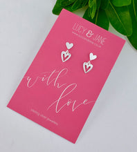 Load image into Gallery viewer, sterling silver double heart drop earrings on a with love Lucy and jane card