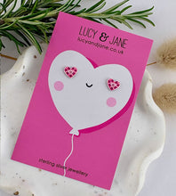 Load image into Gallery viewer, two tone pink sterling silver heart stud earrings on a valentine's card