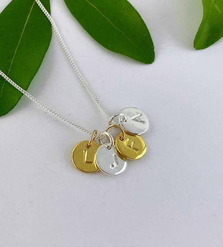 sterling silver four initials necklace in a mix of sterling silver and gold.