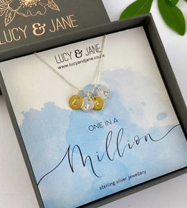 sterling silver and gold initials necklace in a gift box