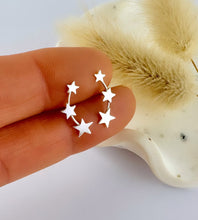 Load image into Gallery viewer, sterling silver graduated star climber earrings featuring three stars in different sizes