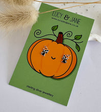 Load image into Gallery viewer, sterling silver black cat earrings wearing a witches hat and displayed on a Halloween themed backing card.