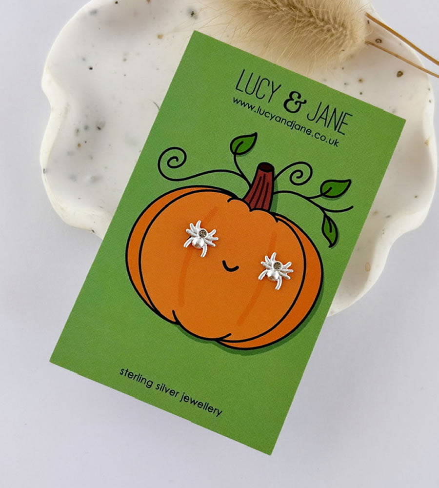 sterling silver spider stud earrings on a pumpkin design Halloween backing card
