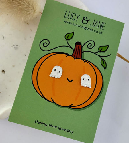 Cute sterling silver white sparkle ghost studs for children on a fun pumpkin Halloween backing card