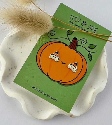 sterling silver cute witch studs on a hallowen themed pumpkin backing card