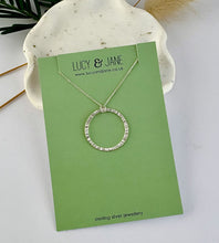 Load image into Gallery viewer, sterling silver hammered circle necklace handcrafted from recycled sterling silver.  Displayed on a Lucy and jane Jewellery card.