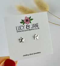 Load image into Gallery viewer, sterling silver star earrings that are gently hammered.  Displayed on a Lucy and Jane jewellery backing card