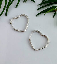 Load image into Gallery viewer, sterling silver heart shaped hoops with a sleeper style fixing