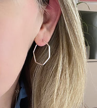 Load image into Gallery viewer, sterling silver hexagon hoops in models ear