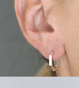 sterling silver geometric hoop in model's ear