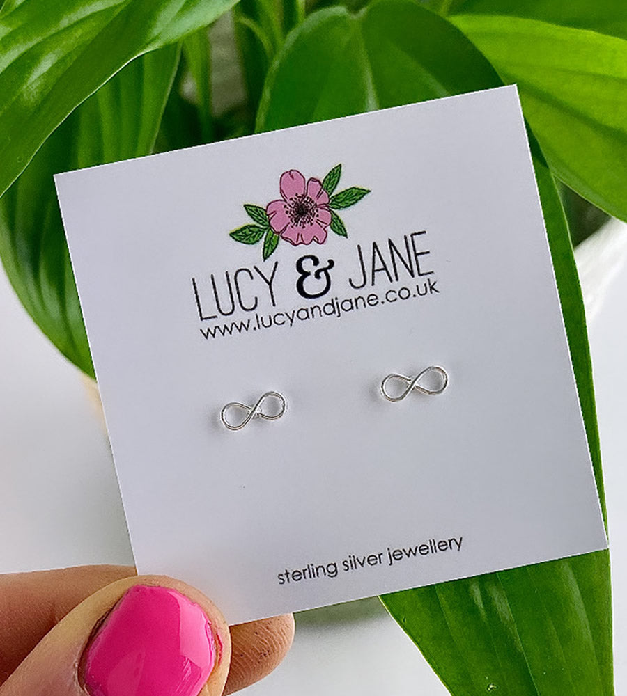 sterling silver infinity studs on a Lucy and Jane card
