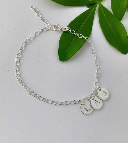 sterling silver initials bracelet wth three hand stamped letters