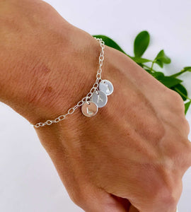 sterling silver letters bracelet on model's wrist