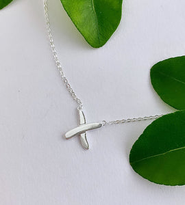 sterling silver chain with a cross charm to look like a kiss.