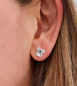 sterling silver koala bear stud earrings in model's ear